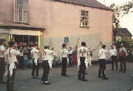 Morris dancers outside the village shop